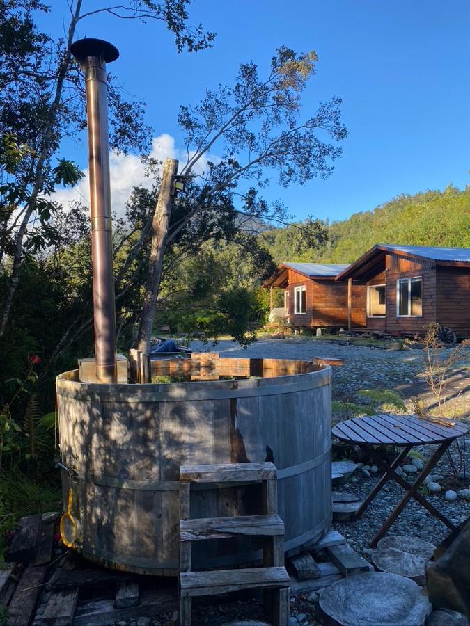 Cabanas & Tinajas Entre Volcanes Hornopiren Exterior foto
